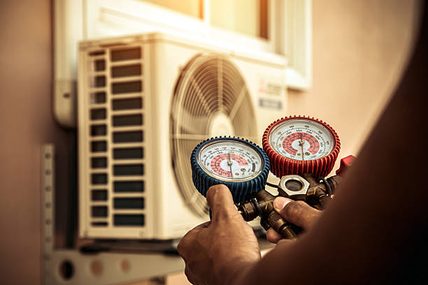 Professional Air Conditioning Service technician working in Bohemia, NY